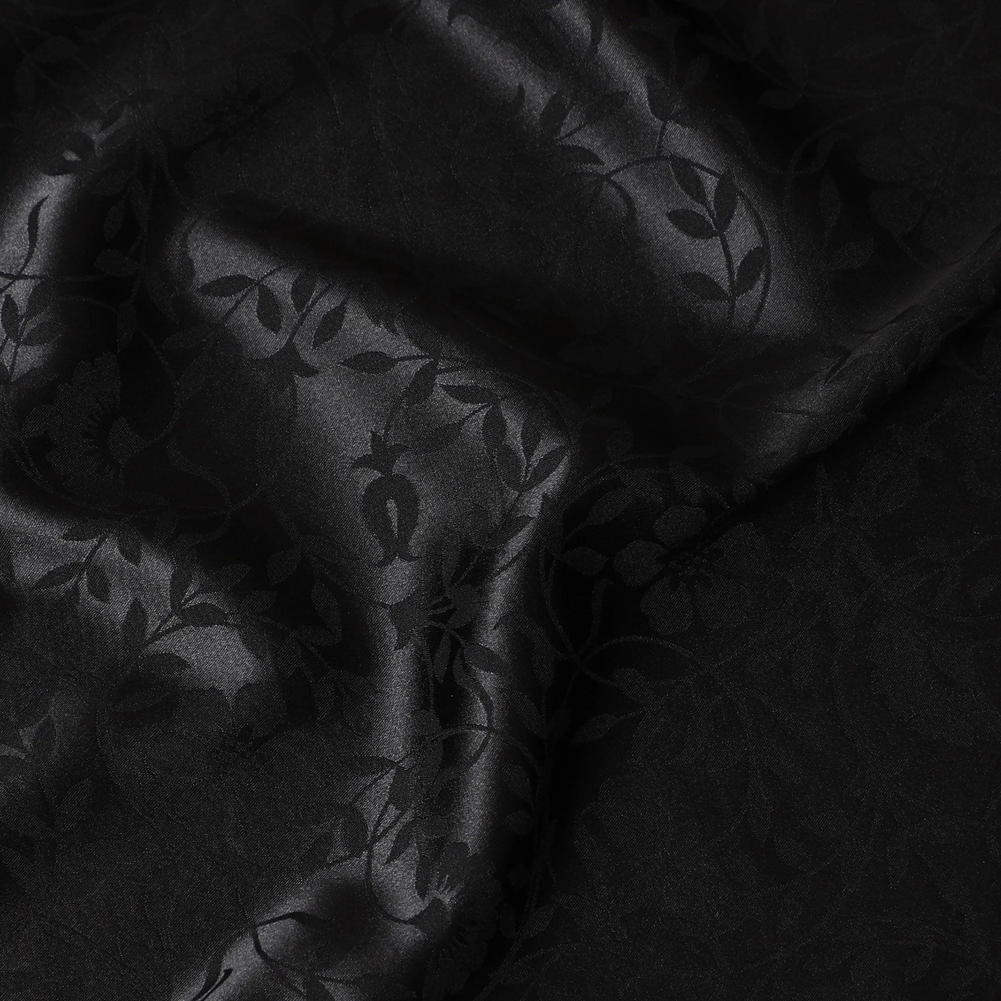 Black synthetic satin fabric with same tone jacquard in floral design-D15373